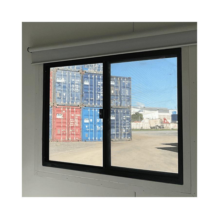 Window installed on a custom shipping container for natural light